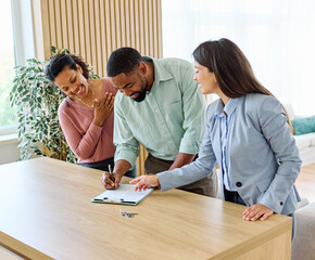Female Real Estate Agent Selling Modern Apartment To His Young Clients , the couple signing agreement contract In The Fancy Apartment