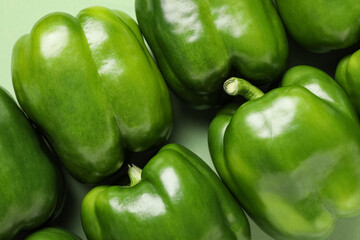 Green bell peppers on color background background, closeup