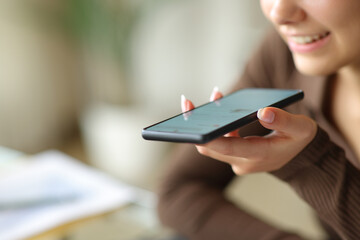 Happy office worker using ai on phone using voice recognition