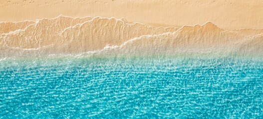 Aerial golden sandy beach ripples meeting turquoise crystal ocean waves abstract minimal top down summer coast. Peaceful nature seascape design scene. Artistic drone pattern paradise travel wanderlust