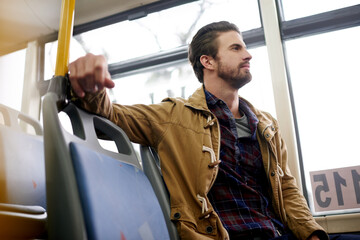 Travel, thinking and man on bus for journey, morning commute and trip on vacation. Public transport, passenger and person with thoughts, vision or daydreaming on holiday for tourism with reflection